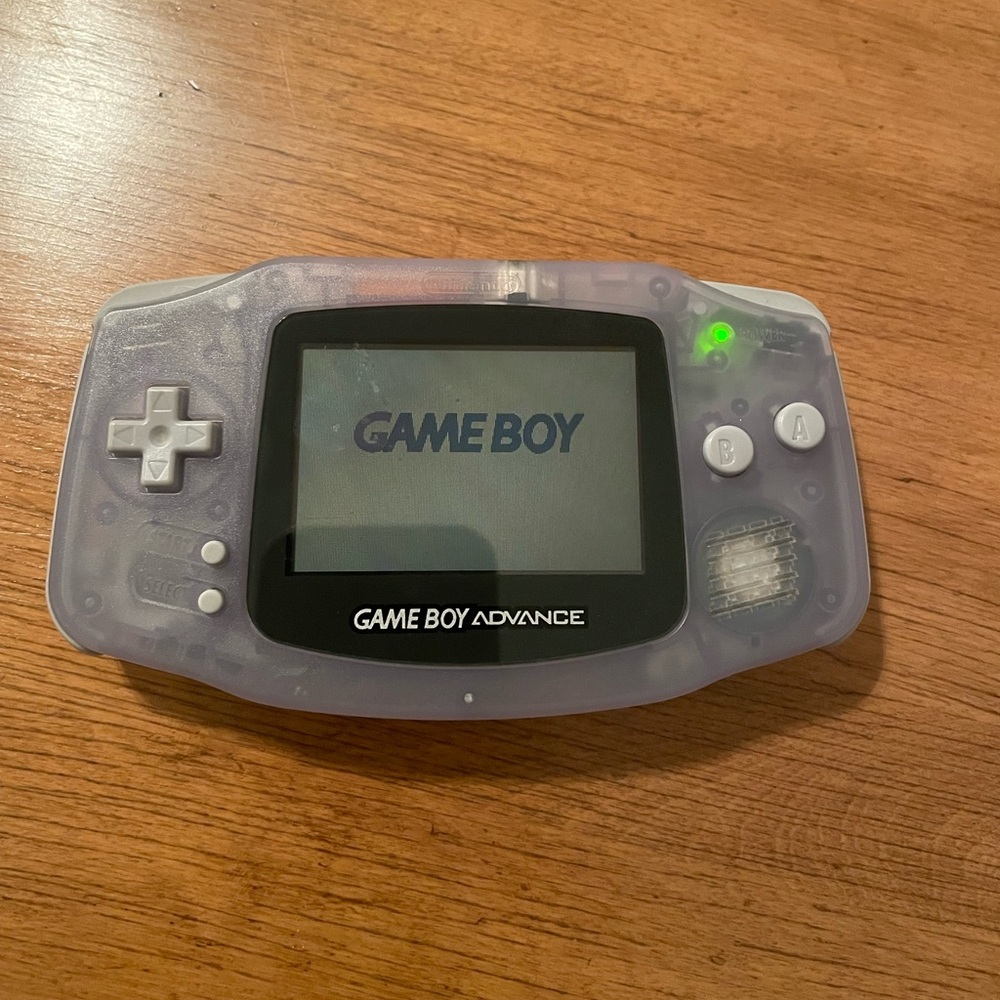 GameBoy Advance with case, light, and 5 games